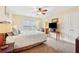 Comfortable bedroom featuring a bed, TV, and a window overlooking a serene view at 1527 Sage Ridge Dr, Marietta, GA 30064