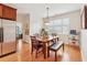 Dining room with hardwood floors, large window, modern lighting, and comfortable seating at 1527 Sage Ridge Dr, Marietta, GA 30064