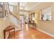 Bright foyer with hardwood floors, high ceilings, staircase, and a view to other living areas at 1527 Sage Ridge Dr, Marietta, GA 30064