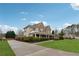 Traditional two-story home exterior features a driveway, manicured lawn and well-maintained landscaping at 1527 Sage Ridge Dr, Marietta, GA 30064