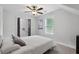 Serene bedroom with a ceiling fan, closet, and a window providing natural light at 257 Birch St, Atlanta, GA 30354