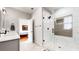 Bathroom featuring a glass-enclosed shower with modern fixtures and neutral tile at 5728 Williams Rd, Norcross, GA 30093
