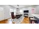 Bright dining area featuring modern lighting, unique furniture and light walls at 5728 Williams Rd, Norcross, GA 30093