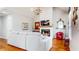 Bright living room with fireplace, hardwood floors and vaulted ceiling with chandelier at 5728 Williams Rd, Norcross, GA 30093