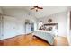 Spacious vaulted-ceiling bedroom with hardwood floors, ensuite bathroom, and walk-in closet at 5728 Williams Rd, Norcross, GA 30093