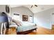 Vaulted ceiling primary bedroom with hardwood floors and natural light from windows at 5728 Williams Rd, Norcross, GA 30093