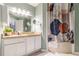 A modern bathroom featuring a granite countertop, white cabinetry, and a decorative shower curtain at 970 Sidney Marcus Blvd # 1217, Atlanta, GA 30324