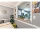 A dining room featuring a pass-through window to the kitchen, white cabinets, and a granite countertop at 970 Sidney Marcus Blvd # 1217, Atlanta, GA 30324