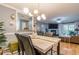 Apartment dining room with an open floor plan and modern light fixture at 970 Sidney Marcus Blvd # 1217, Atlanta, GA 30324