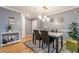 Apartment dining room with modern light fixture and white trim at 970 Sidney Marcus Blvd # 1217, Atlanta, GA 30324