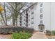 Apartment building exterior with well-maintained landscaping and covered entrance at 970 Sidney Marcus Blvd # 1217, Atlanta, GA 30324