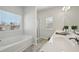 Bathroom featuring a tub, shower, tile flooring, and a large vanity with ample counterspace at 1566 Winding Ridge Trl, Hoschton, GA 30548