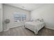 Bedroom featuring natural light, neutral colored walls, and comfortable bedding at 1566 Winding Ridge Trl, Hoschton, GA 30548
