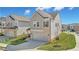 Charming two-story home featuring manicured lawn and two-car garage at 1566 Winding Ridge Trl, Hoschton, GA 30548