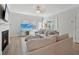 Cozy living room with fireplace, hardwood floors, and modern decor and plenty of seating at 1566 Winding Ridge Trl, Hoschton, GA 30548