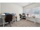 Bright home office featuring a comfortable work space with natural light from the window at 1566 Winding Ridge Trl, Hoschton, GA 30548
