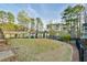A spacious backyard and exterior building featuring a well-manicured lawn at 808 Riverview Se Dr, Marietta, GA 30067