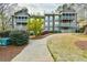 Multi-level exterior with balconies, large windows, and a beautifully landscaped yard at 808 Riverview Se Dr, Marietta, GA 30067