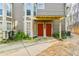 Townhouse exterior featuring a sidewalk leading to two red front doors under a shared, covered entrance at 808 Riverview Se Dr, Marietta, GA 30067