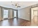 Bedroom featuring two windows with blinds and curtains and a doorway leading to the hallway at 808 Riverview Se Dr, Marietta, GA 30067