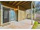 A covered patio featuring a sliding glass door, storage room, and privacy fence at 808 Riverview Se Dr, Marietta, GA 30067