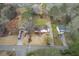 An overhead view showcasing the home's layout, surroundings, and a long driveway with parking at 532 Rivercrest Dr, Woodstock, GA 30188