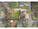 Aerial view of home with expansive green backyard and driveway; showcases proximity to neighboring houses at 532 Rivercrest Dr, Woodstock, GA 30188