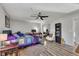 Spacious bedroom with ceiling fan, hardwood floors, desk, and natural light at 532 Rivercrest Dr, Woodstock, GA 30188