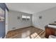 Bedroom featuring hardwood floors, a window, and neutral color scheme at 532 Rivercrest Dr, Woodstock, GA 30188