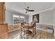 Cozy dining room features a round wood table and decorative wainscoting for a classic look at 532 Rivercrest Dr, Woodstock, GA 30188