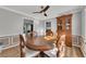 Dining area with wood floors and crown molding features a classic wood table set at 532 Rivercrest Dr, Woodstock, GA 30188