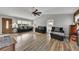 Spacious living room with a cozy brick fireplace, bright windows, and stylish, comfortable seating at 532 Rivercrest Dr, Woodstock, GA 30188