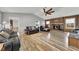 Spacious living room with a brick fireplace, vaulted ceiling, and stylish wood-look floors at 532 Rivercrest Dr, Woodstock, GA 30188