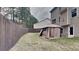 Fenced backyard featuring an outdoor canopy, providing a great space for relaxation and outdoor activities at 634 Sandpiper Cv, Stockbridge, GA 30281