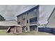Exterior view of the backyard highlighting the fenced yard, canopy and screened-in balcony, great for outdoor living at 634 Sandpiper Cv, Stockbridge, GA 30281