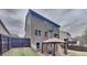 Large backyard with a canopy and a wooden fence, offering privacy and space for entertaining guests at 634 Sandpiper Cv, Stockbridge, GA 30281