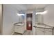 The bathroom features dual sinks with granite countertops and modern fixtures at 634 Sandpiper Cv, Stockbridge, GA 30281