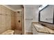 Bathroom featuring a walk-in shower with a seat and a vanity with granite counters at 634 Sandpiper Cv, Stockbridge, GA 30281