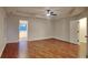 Spacious bedroom boasts hardwood floors and a trey ceiling with ceiling fan at 634 Sandpiper Cv, Stockbridge, GA 30281