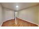 Cozy bedroom showcasing hardwood floors, a double-door closet, and recessed lighting at 634 Sandpiper Cv, Stockbridge, GA 30281