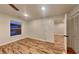A cozy bedroom features new wood floors, a large window, and ample closet space at 634 Sandpiper Cv, Stockbridge, GA 30281