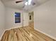 Bedroom with wood flooring, ceiling fan and natural light from large windows at 634 Sandpiper Cv, Stockbridge, GA 30281