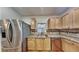 Modern kitchen with stainless steel appliances, granite countertops, wood cabinets, and stylish tile backsplash at 634 Sandpiper Cv, Stockbridge, GA 30281