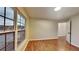 Bright living room featuring a large window, hardwood floors, and a neutral color scheme at 634 Sandpiper Cv, Stockbridge, GA 30281