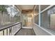 A covered patio featuring wood floors, siding and large windows overlooking the yard at 634 Sandpiper Cv, Stockbridge, GA 30281