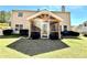 Spacious backyard featuring a screened porch addition, lush grass, and tidy landscaping at 1002 River Plantation Drive, Woodstock, GA 30188