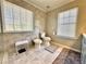 This bathroom features neutral-toned tiling, two large windows, and a bidet at 1002 River Plantation Drive, Woodstock, GA 30188