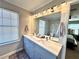 Modern bathroom with a double sink vanity, granite countertop and stylish faucets at 1002 River Plantation Drive, Woodstock, GA 30188