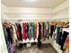 Walk-in closet with multiple rows of clothing racks and wire shelving at 1002 River Plantation Drive, Woodstock, GA 30188