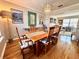 Open dining room with decorative light fixture and connected living spaces at 1002 River Plantation Drive, Woodstock, GA 30188